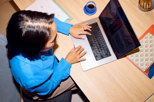 Busy woman working on a laptop