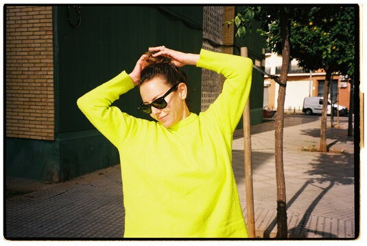 Woman in Neon Sweater
