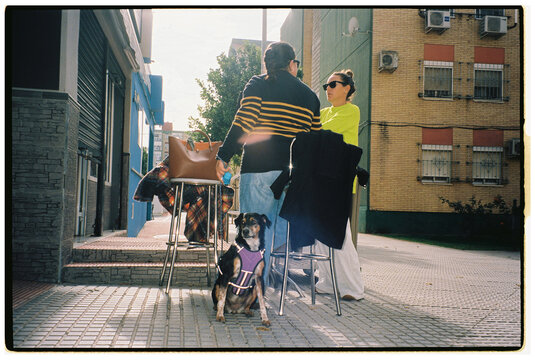 Dog With Two Women at cafe 
