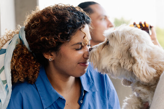 Woman bonding with pet dog