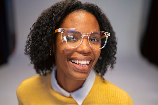 Authentic smiling portrait of a young woman