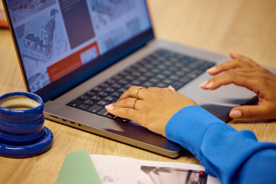 Anonymous woman typing on a laptop