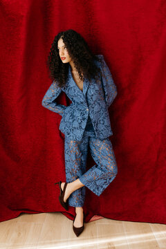 Woman modeling blue lace suit 