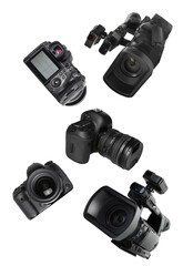Photo and video cameras flying in air on white background