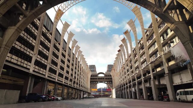 tilt-up movement revealing the monumental concrete sunshades and symmetrical ramps of Venezuelan Supreme Tribunal of Justice.