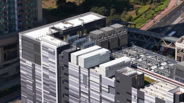 Aerial drone video of a large scale data center in Hong Kong, China, showcasing big data processing, artificial intelligence and machine learning infrastructure, colocation services, and cloud storage