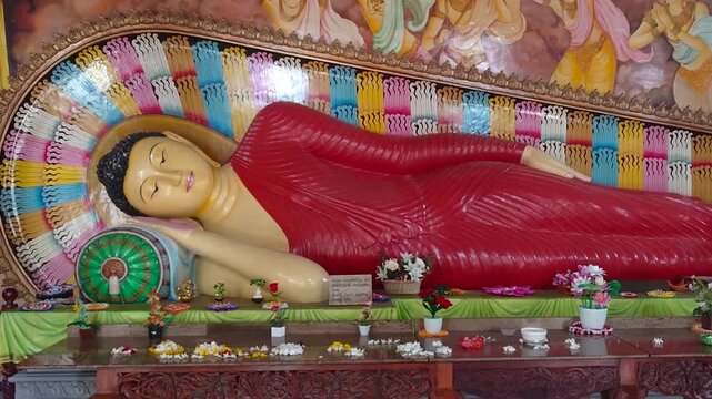 Sacred reclining Buddha statue symbolizing Parinirvana, the Buddha&rsquo;s final passing into enlightenment. Peaceful spiritual scene ideal for themes of Buddhism, meditation, serenity, and Asian heritage.