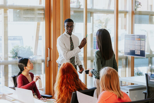 Diverse group collaborating in modern office