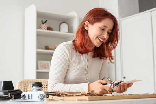 Woman making family tree at home