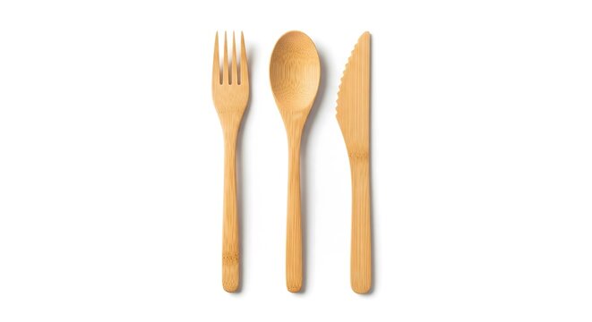 Eco-friendly wooden cutlery set with fork, spoon, and knife isolated on white background. Sustainable bamboo kitchenware top view for zero waste lifestyle and natural dining concept.