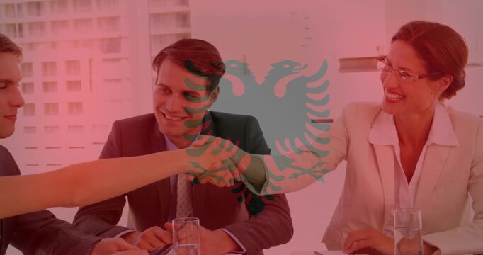 Business team meeting, female reaching to entrant on arrival, handshaking under red emblem overlay