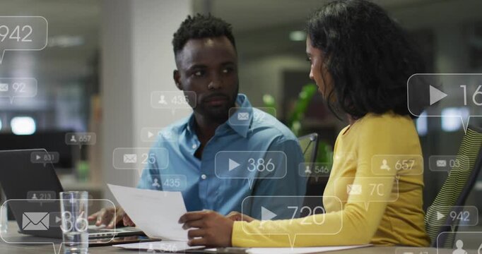 Duo chatting at desk pinging social icons bubbles counting boosting social reach laptop CTA showing