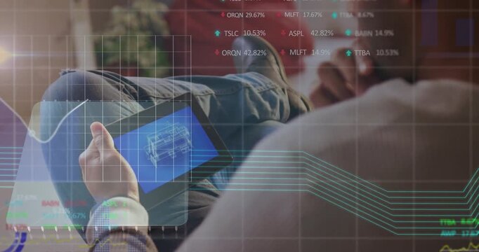 Man on couch moving tablet, tapping screen and reviewing tech schematic as HUD graphs updating