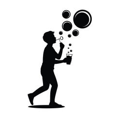 Silhouette of a boy blowing bubbles with a bubble wand