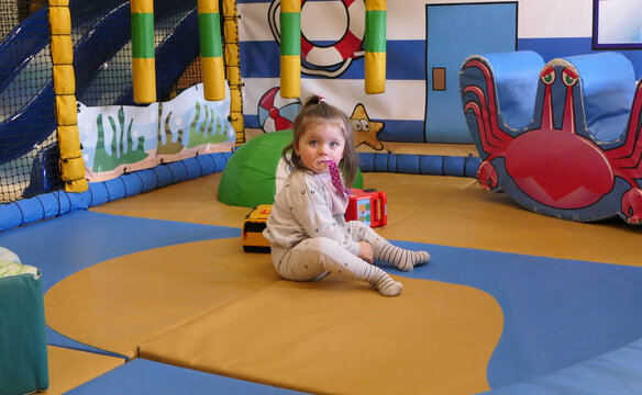 Photo of Children having fun playing in indoor soft play area