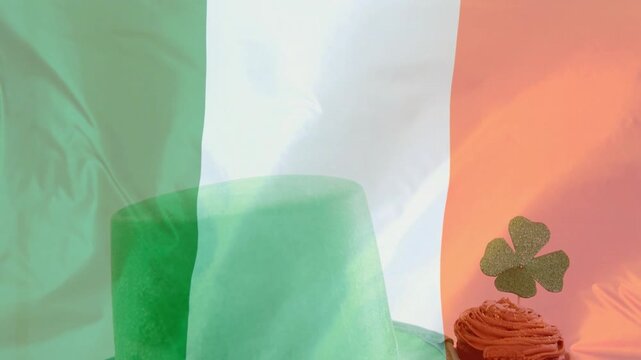 Flag folding revealing green top hat rising cupcake emerging shamrock settling for St Patrick's Day