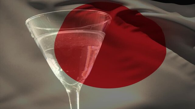 Cocktail glass holding liquid while fruits dropping offscreen, causing splash to show highlights