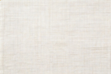 Fototapeta premium Plain white linen fabric texture background with a subtle woven pattern. Clean, neutral surface ideal for design or product placement without distractions.
