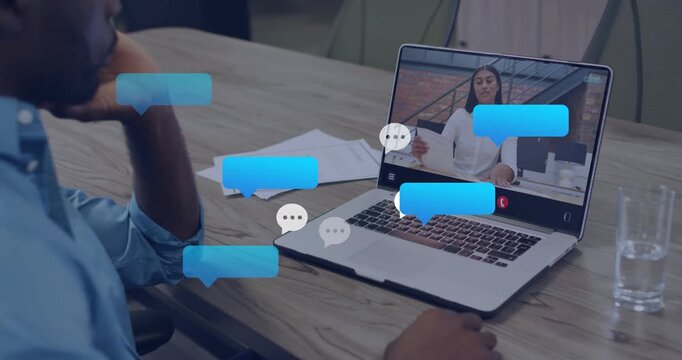 Man reaching laptop in biz call, host gesturing causing chat bubbles popping then fading over keys