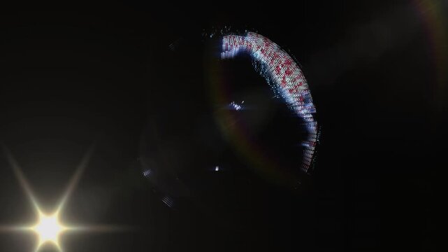 3D globe rotating bright point appearing then bursting scattering dots reforming showing lens flare