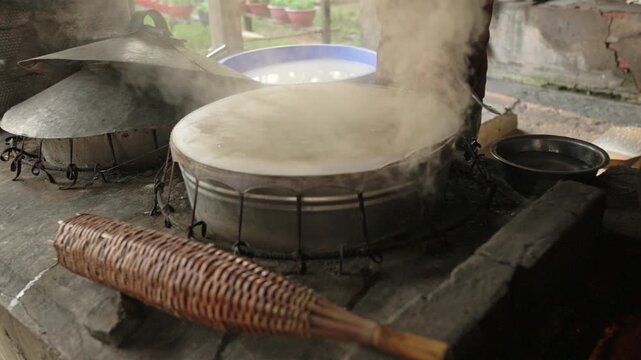 Cooking Area Filled With Rising Vapor. Clouds And Mist Hover Above Hot Cooking Station With Rising Fumes. Vapor And Mist Envelop Entire Cooking Space As Steam Rises From Prepared Dishes