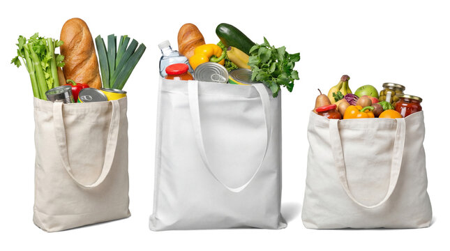 three canvas grocery bags overflowing with fresh groceries and bread, studio shot on transparent background, realistic photograph