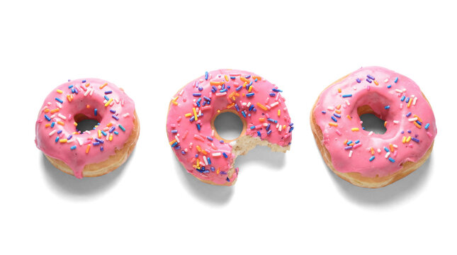 three iced donuts with colorful sprinkles on a transparent background, one donut with a bite taken out, perfect for food blogs and sweet treat promotions.