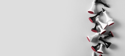 Many chess pieces on light background with space for text, top view © Pixel-Shot