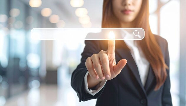 Gemini berkata

A young businesswoman uses her finger to touch a virtual screen interface, representing a futuristic digital technology concept where a person interacts with a network or internet choi
