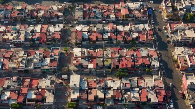 Aerial footage of dense Ecatepec neighborhoods at dusk, Mexico