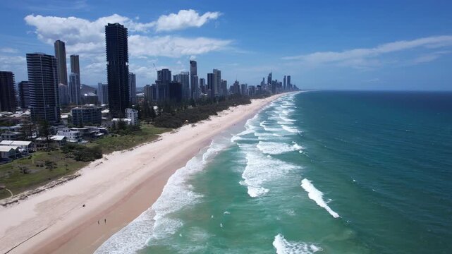 High-rise Skyline Along Sandy Shore Of Mermaid Beach In Gold Coast, Queensland. aerial sideways shot