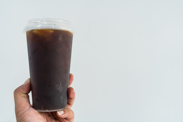 Cold brew coffee in clear plastic cup, refreshing beverage offers energizing morning boost, perfect for hot