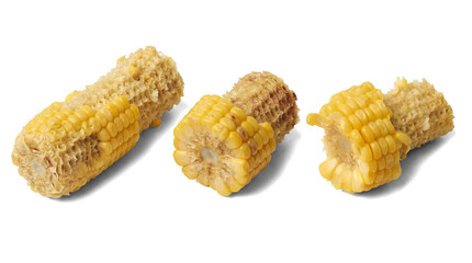 detail photograph of three bare corn cob cores, devoid of kernels, isolated against a solid white backdrop.