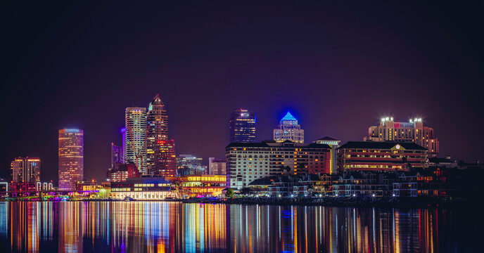 Panoramic Tampa Downtown Skyline at Night with Colorful Reflections