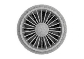 A close-up view of a circular fan with intricate metal blades radiating from the center