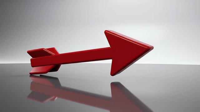 A shiny red arrow points downwards, reflecting on a dark, glossy surface