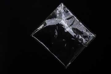 plastic package on black background