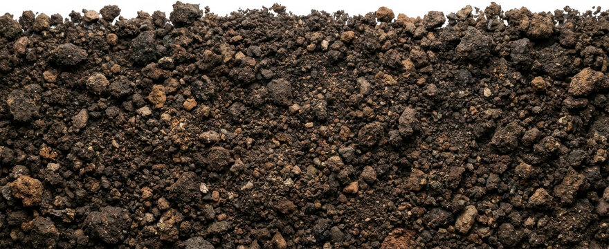 Close up macro view of dry granular rocky soil composed of small brown and black earth particles creating a natural textured surface dirt ground nature closeup earthy agriculture