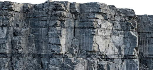 Fototapeta premium Detailed texture of a weathered grey rock face with visible strata and carved parallel lines showcasing natural geological patterns and signs of quarrying stone layers rough