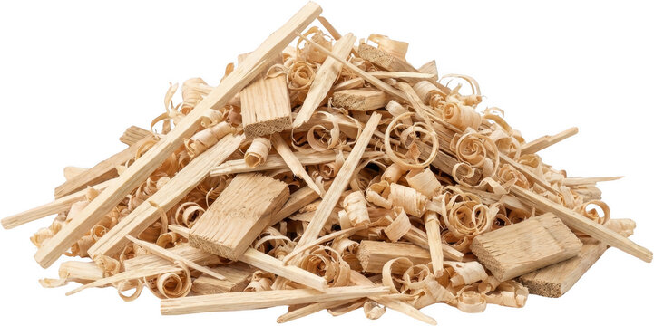 A pile of light colored wooden shavings and chips from woodworking with visible grain patterns and curled shavings wood shavings sawdust wood chips lumber timber carpentry
