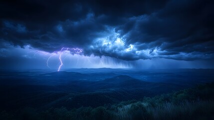 Powerful electrical discharge illuminates dark, stormy sky over rolling wilderness landscape