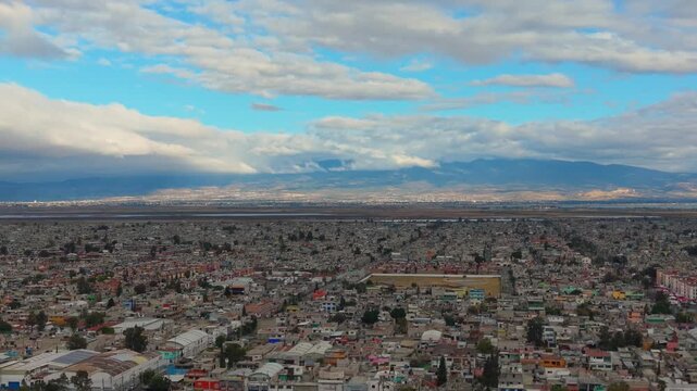 Aerial perspective of Ecatepec metropolitan area under overcast skies