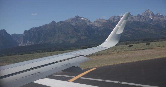 Taxiing Past the Grand Teton Mountains from a Passenger Jet Window