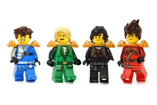 Editorial illustrative image of meeting of two lego ninjago minifigures teamisolated on white. Popular lego theme to 15 Years edition.