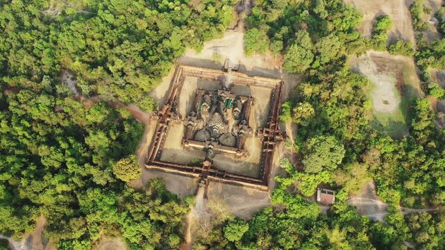 Drone shot of the ancient Banteay Samre temple surrounded by lush forest in Cambodia. The historic site is seen from above, highlighting its architectural layout and natural setting.