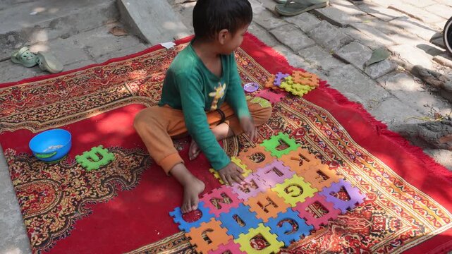 Child Playing Colorful Alphabet Puzzle Educational Learning Toy