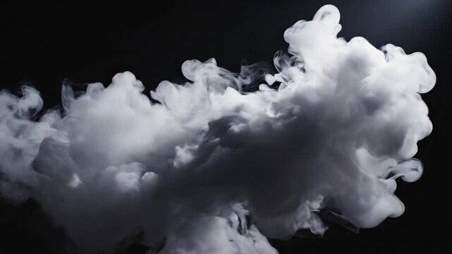 A cloud of white smoke against a dark background with a beam of light