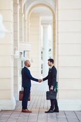 Corporate, people and lawyer with handshake in city for welcome, thank you and legal agreement. Men, attorney and shaking hands for introduction, client negotiation and partnership of case settlement © BuyoutReese09/peopleimages.com