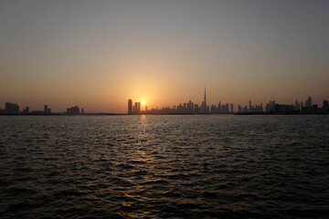 Fototapeta premium Creek Harbour sunset, Dubai Promenade, skyline, Burj Khalifa