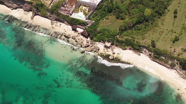 A 4k drone shot of a crystal clear costline in Bali Indonesia